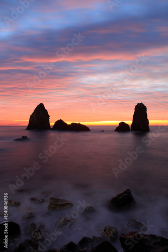 Cyclops stacks in Aci Trezza at sunrise, Sicily, Italy
