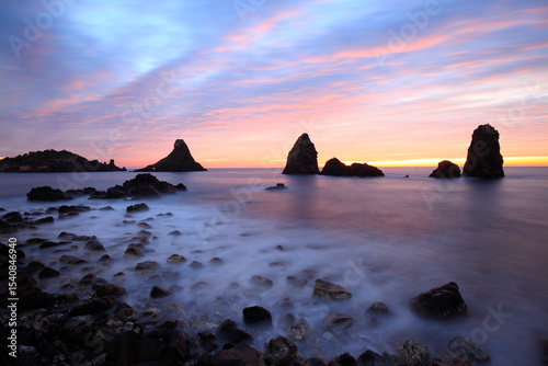 Cyclops stacks in Aci Trezza at sunrise, Sicily, Italy