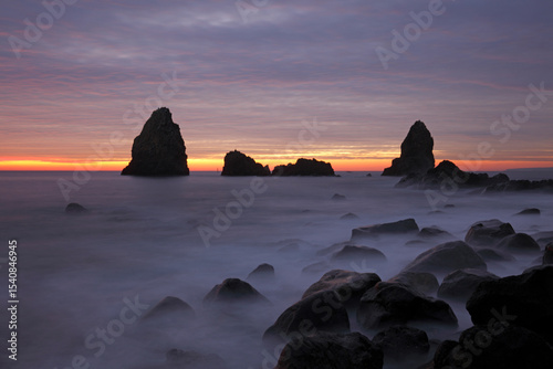Cyclops stacks in Aci Trezza at sunrise, Sicily, Italy
