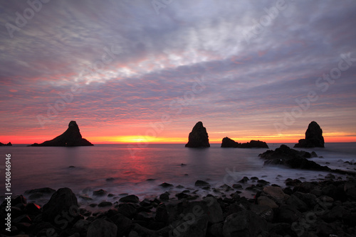 Cyclops stacks in Aci Trezza at sunrise, Sicily, Italy