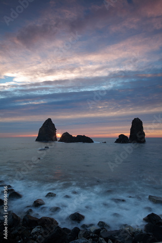 Cyclops stacks in Aci Trezza at sunrise, Sicily, Italy