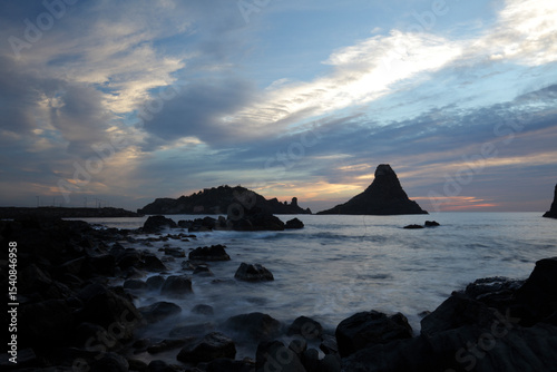 Cyclops stacks in Aci Trezza at sunrise, Sicily, Italy