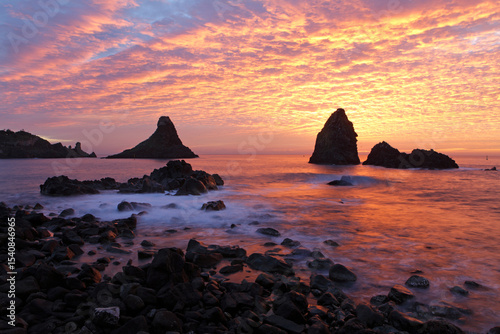 Cyclops stacks in Aci Trezza at sunrise, Sicily, Italy