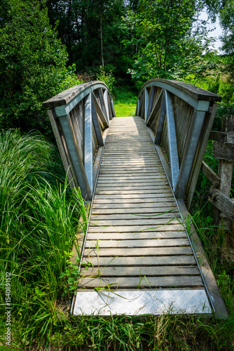 Wood and tell Bridges over the Mitternacher Ohe River in the bavarian Forests Germany.