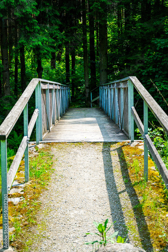 Wood and tell Bridges over the Mitternacher Ohe River in the bavarian Forests Germany.