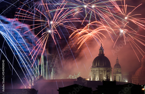 The fireworks of the feast of Sant'Agata, patron saint of Catania, with a small view of the Cathedral.