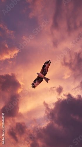 Majestic Hawk Soaring Through Colorful Clouds at Sunset Over a Serene Landscape.