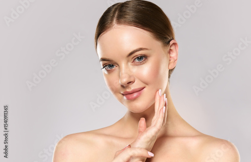 Beautiful Young Woman with Clean Fresh Skin . Facial treatment . Cosmetology , beauty and spa . Skin care

