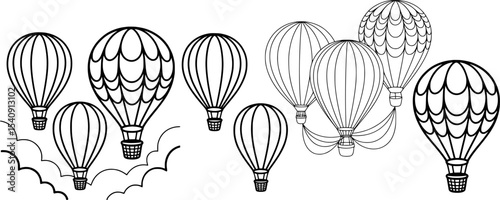 Group of black and white hot air balloons floating against a white background