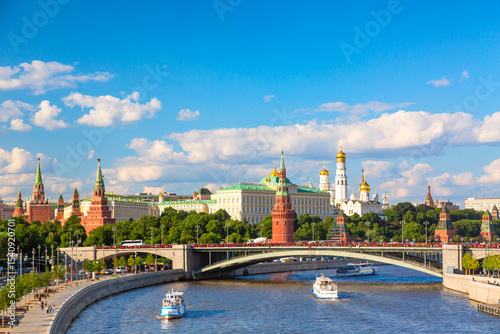 View of Moscow Kremlin, Moscow River, sightseeing ships and Big Stone bridge during summer sunny day. Landmark in Moscow, Russia