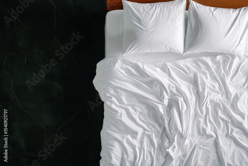 Comfortable White Bedding on a Neatly Arranged Bed in a Modern Bedroom Setting.