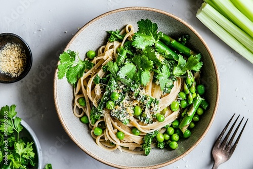 Fresh Green Pasta With Peas and Herbs Served in a Bowl on a Light Surface