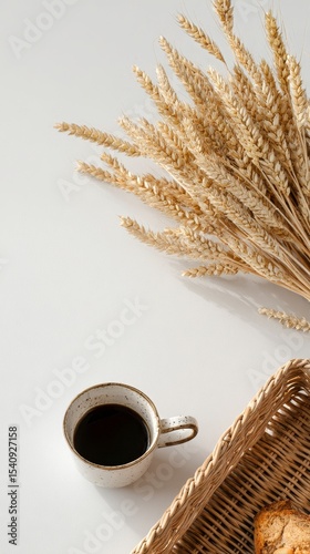 Enjoying a Warm Drink With Fresh Bread and Dried Wheat Decor in a Cozy Setting