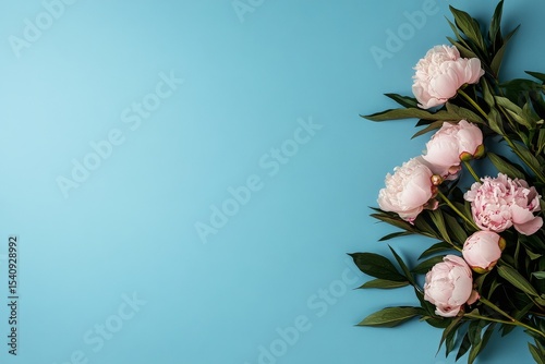 Bouquet of Soft Pink Flowers Arranged Against a Turquoise Background for Flor...