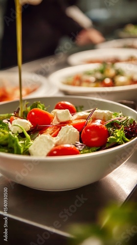 Fresh Salad Preparation With Cherry Tomatoes and Greens in a Culinary Kitchen...