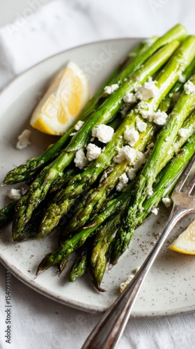 Grilled Asparagus With Lemon and Cheese Served on a Plate