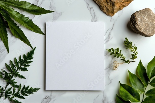Natural Materials Arranged Around Blank Canvas on Marble Surface for Artistic...