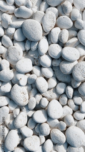 White Pebbles Covering a Sandy Beach at Midday Creating a Serene Atmosphere f...
