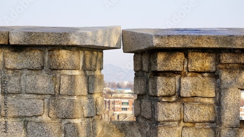 Fotografie Closeup of an ancient stone wall fortification in Seoul Korea