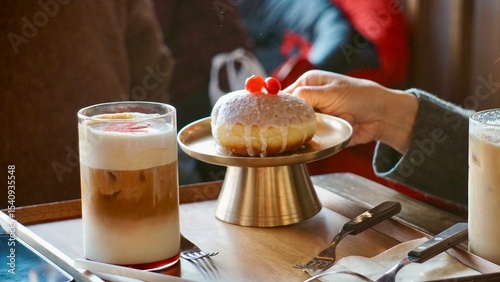 Gourmet coffee and doughnuts with cherries at a cafe in Seoul Korea