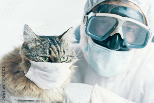 A person and a cat are both wearing masks in a photo, highlighting the importance of pandemic safety and care