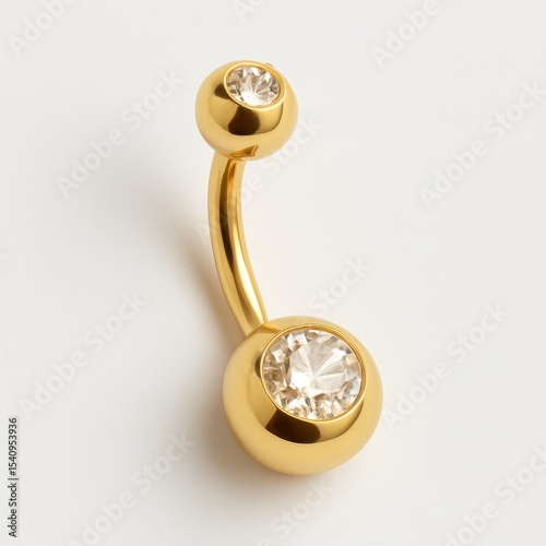 Golden curved belly button ring with two round champagne-colored crystals, photographed isolated on white.
