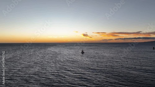 Waikiki orange sunset with sailboat