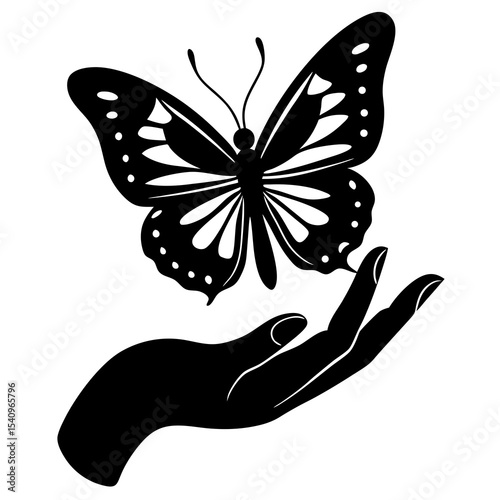 Silhouette of hand gently holding a butterfly