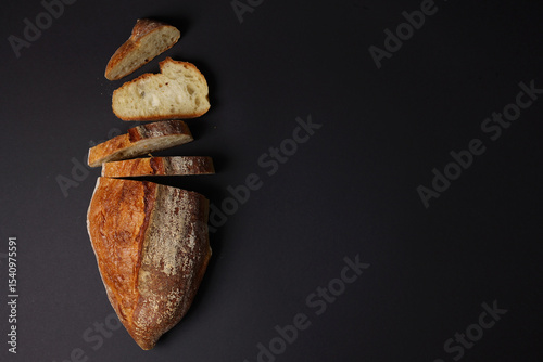 A Beautiful Composition of Artisan Bread Slices Presented on a Dark Background Surface