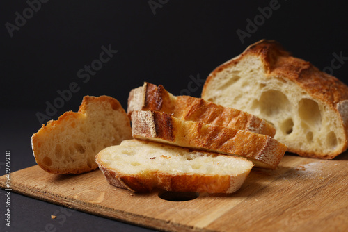 A Beautiful Composition of Artisan Bread Slices Presented on a Dark Background Surface