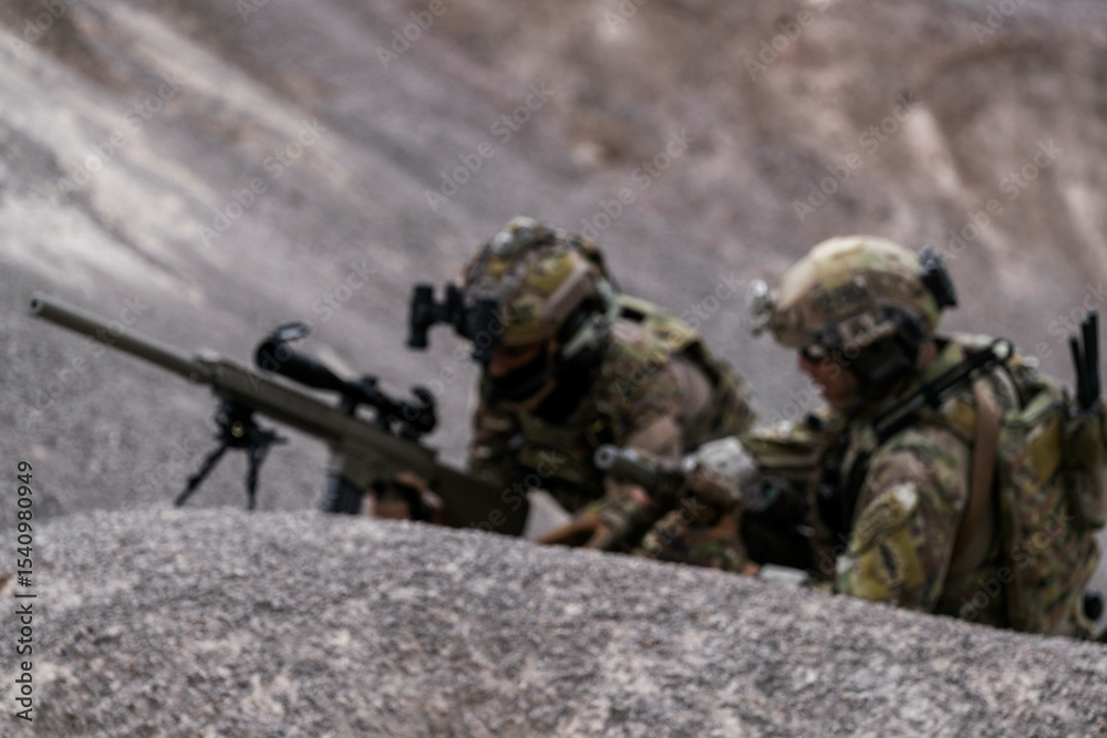 Special Forces Soldiers Armed and Ready During Tactical Training – Focused Military Men in Camouflage Uniform, Holding Assault Rifles, Outdoor Combat Operation in Desert Terrain Special Forces Soldiers Armed and Ready During Tactical Training – Focused Military Men in Camouflage Uniform, Holding Assault Rifles, Outdoor Combat Operation in Desert Terrain