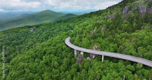 Car road trip on Blue Ridge Parkway in North Carolina. Linn Cove Viaduct in Appalachian mountains in summer rain season. Summertime landscape of beautiful nature