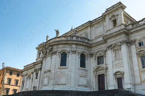 Rear view of the Basilica of Santa Maria Maggiore from Piazza dell'Esquilino, in the city of Rome, on a sunny day.

