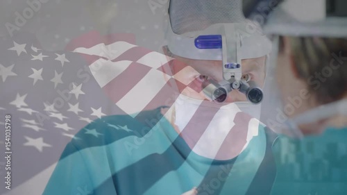 Console illuminating medical monitor, surgeon adjusting loupe, performing surgery with flag overlay