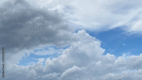 A dramatic cloudy sky just before rainfall, with layers of soft gray clouds spreading across the atmosphere. Perfect for weather, nature, and mood-related themes. 