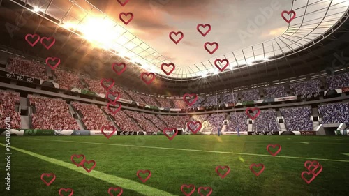 At kickoff heart outlines appearing on pitch drifting upward across stands representing fan passion