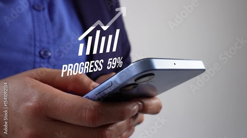 Close-up of a person's hands holding a cell phone and an animation of a loading arrow icon: progress from 0 to 100%.