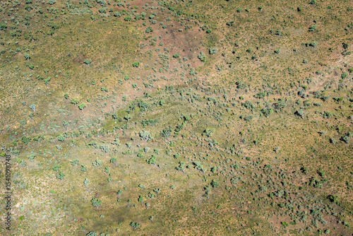 Australian outback sparse bush below covering land in Kimberleys