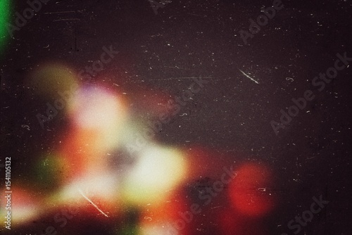 Fototapeta Naklejka Na Ścianę i Meble -  Grainy Film dust texture overlay for a retro effect. Grunge old film grit, grain, and scratches. Empty vintage background for grungy design. Abstract light leaks overlay effect, noise texture