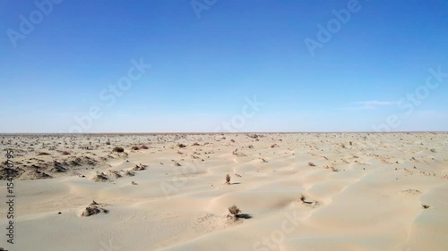 Drone view of Gobi desert on sunny autumn day in Hotan, Kashgar, Xinjiang, China, 4k real time footage, travel concept. 