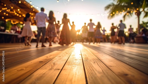 People dancing at a sunset celebration.