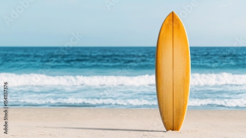 Classic Wooden Surfboard on Sandy Beach with Ocean Waves in Background Under Clear Blue Sky