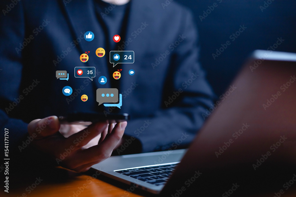 Naklejka premium Social media and digital online, man using smart phone use social media network application, Friend reply chat concept or send emoticon for react feeling, playing Social media Distancing.