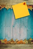 Autumn leaves with yellow note