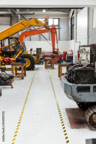 Yellow excavator loader is sitting in flat design workshop with safety tape guiding aisles