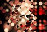 Abstract composition showing red black beige maple leaves scattering over warm bokeh orb backdrop