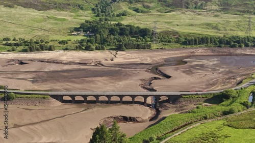 Aerial view of a dramatically low Woodhead Reservoir during drought conditions, The reservoir, part of a system supplying drinking water to Greater Manchester, lies in North Derbyshire, June 2025