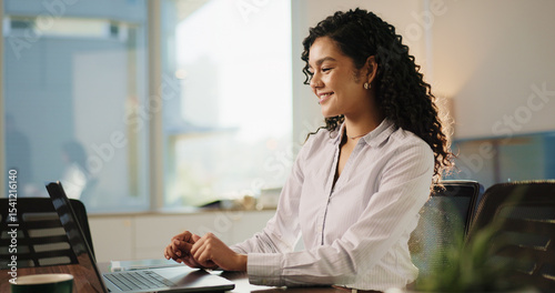 Lawyer, woman and laptop in office for research, advocate and case thinking. Legal aid, smile and online report for opportunity with attorney person with law firm, agency and reading legislation