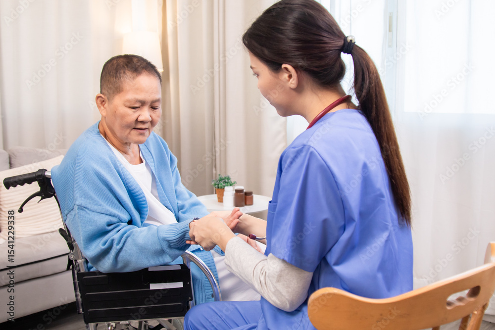 Obraz premium Young nurse and senior woman seated face to face, holding hands, engaging in compassionate conversation, showing attentive care and patient-centered communication at home, healthcare.