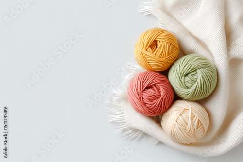 Wallpaper Mural Wool yarn skeins on white textile, clean background with space for text. Torontodigital.ca